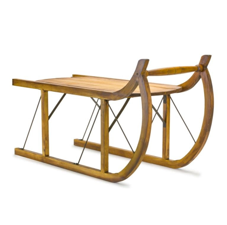 Wood sled with curved runners in natural finish