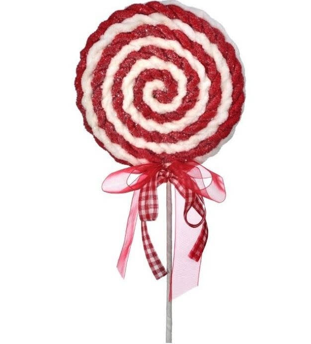 Red and white spiral fabric lollipop decoration with a gingham and sheer red ribbon bow on a stem.