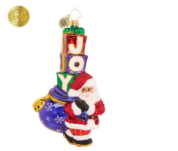 Joyous Saint Nick ornament with tall Santa sack filled with presents spelling J-O-Y.