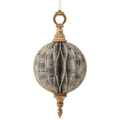 Cardboard finial ornament with music note patterns in a festive holiday style
