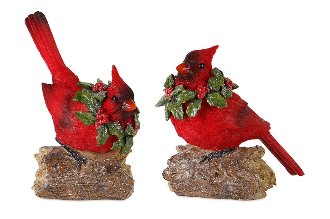 Polyresin cardinal bird figurine perched on a log with snowy white accents and realistic painted finish.