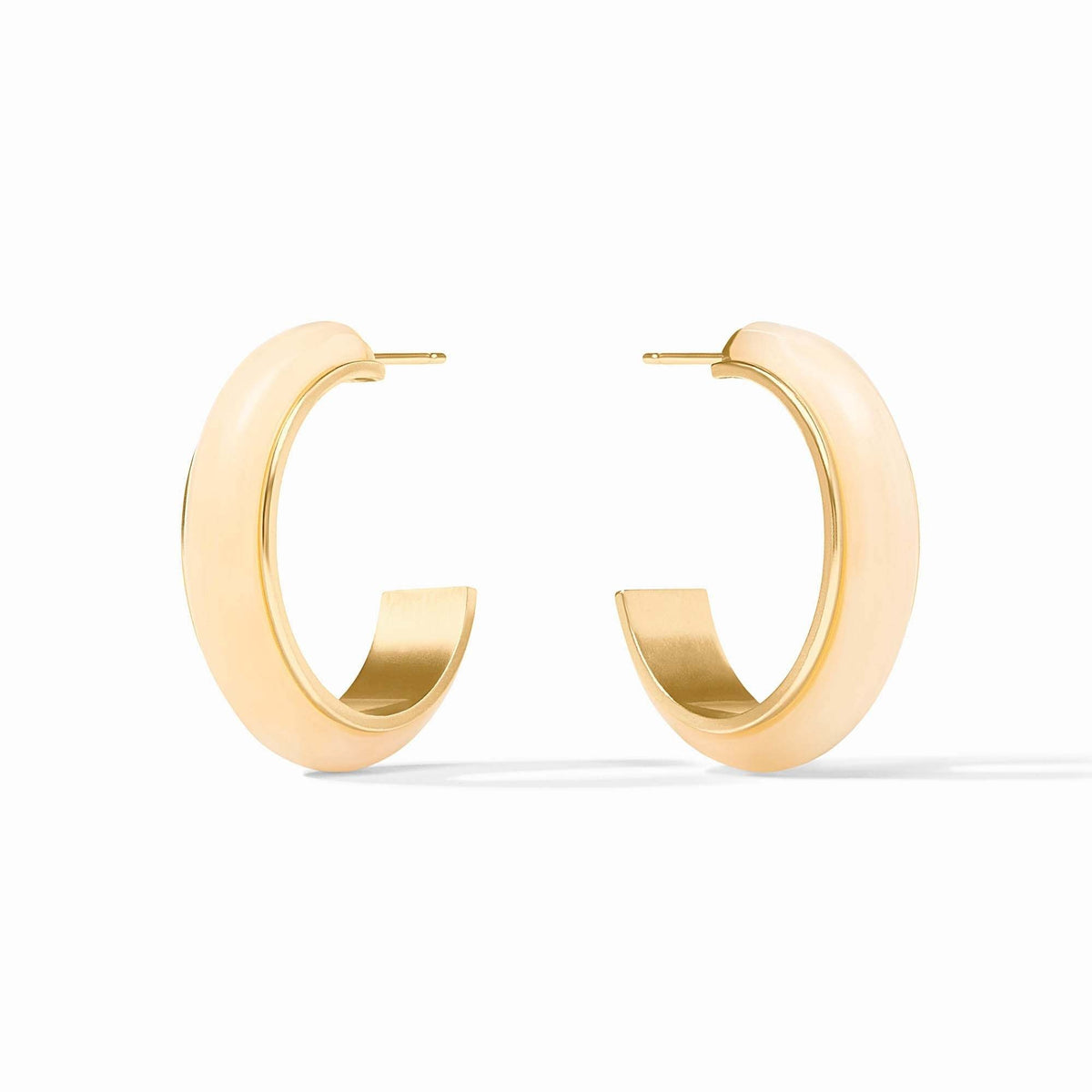 Medium ivory Carnaby hoop earrings with acetate posts featuring a polished gold finish.
