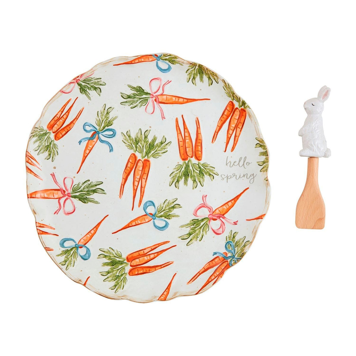 Hand-painted stoneware platter with carrot pattern set on wooden spatula