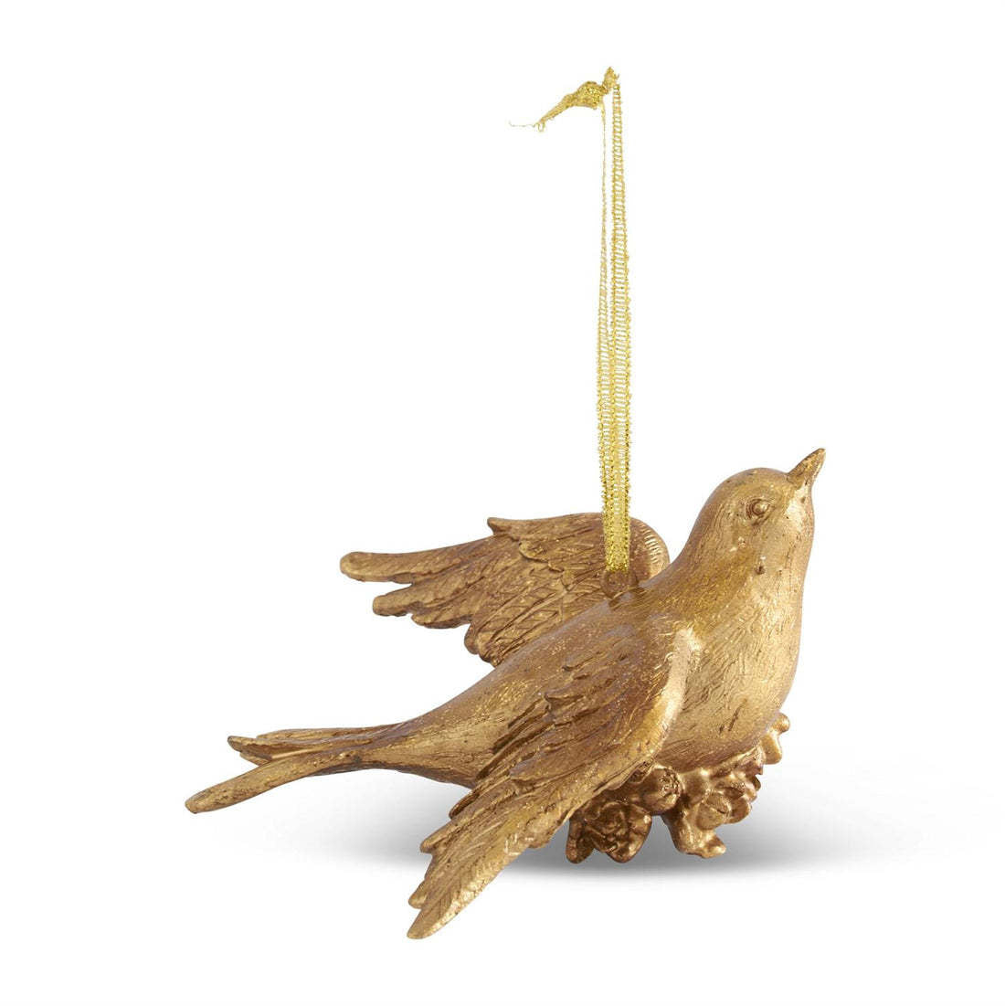 Carved resin bird ornament with gold leaf accents in a natural pose