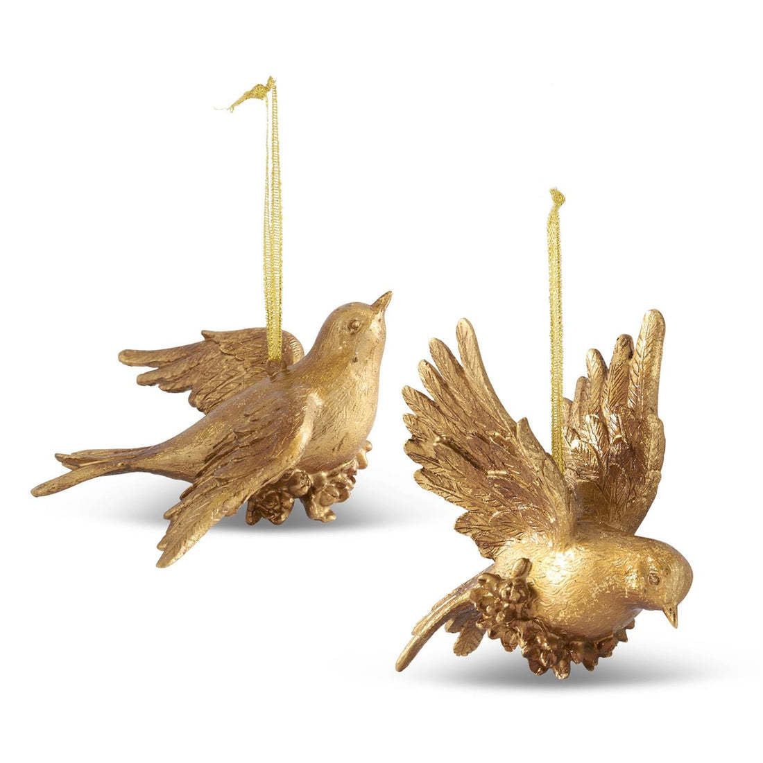 Carved resin bird ornament with gold leaf accents in a stylized silhouette.