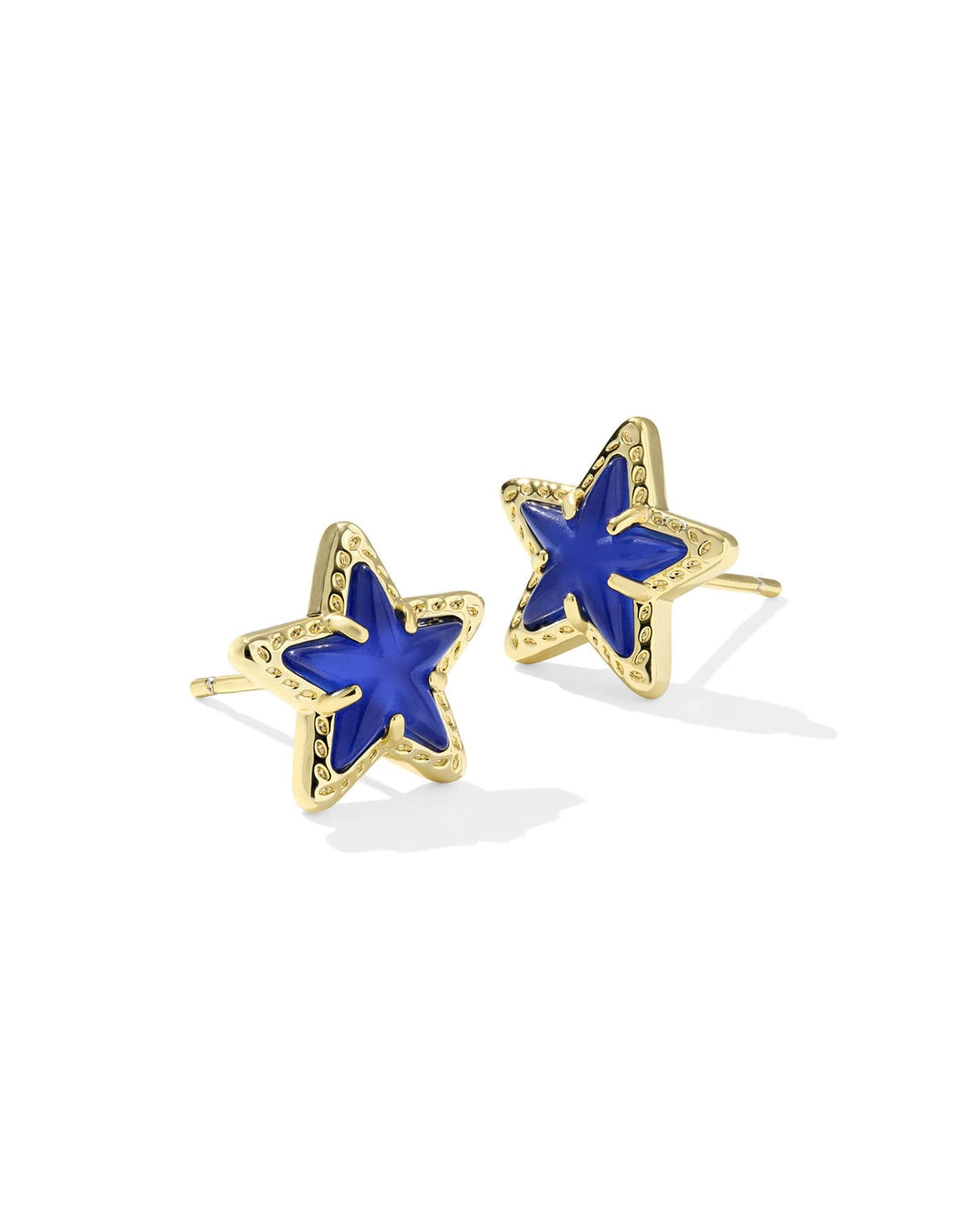 Gold Cassidy stud earrings featuring a cobalt blue illusion starburst pattern on the front face.