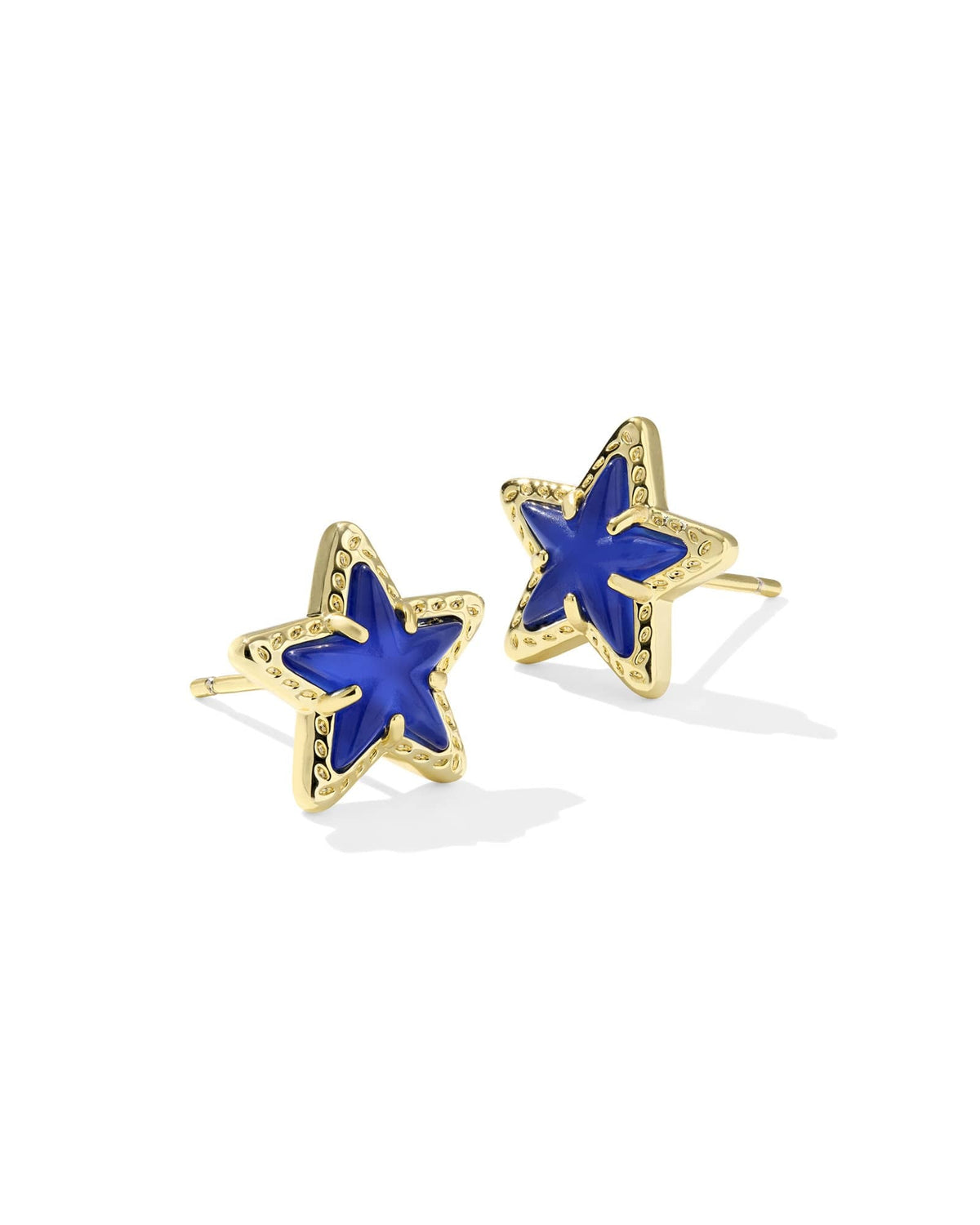 Gold Cassidy stud earrings featuring a cobalt blue illusion starburst pattern on the front face.