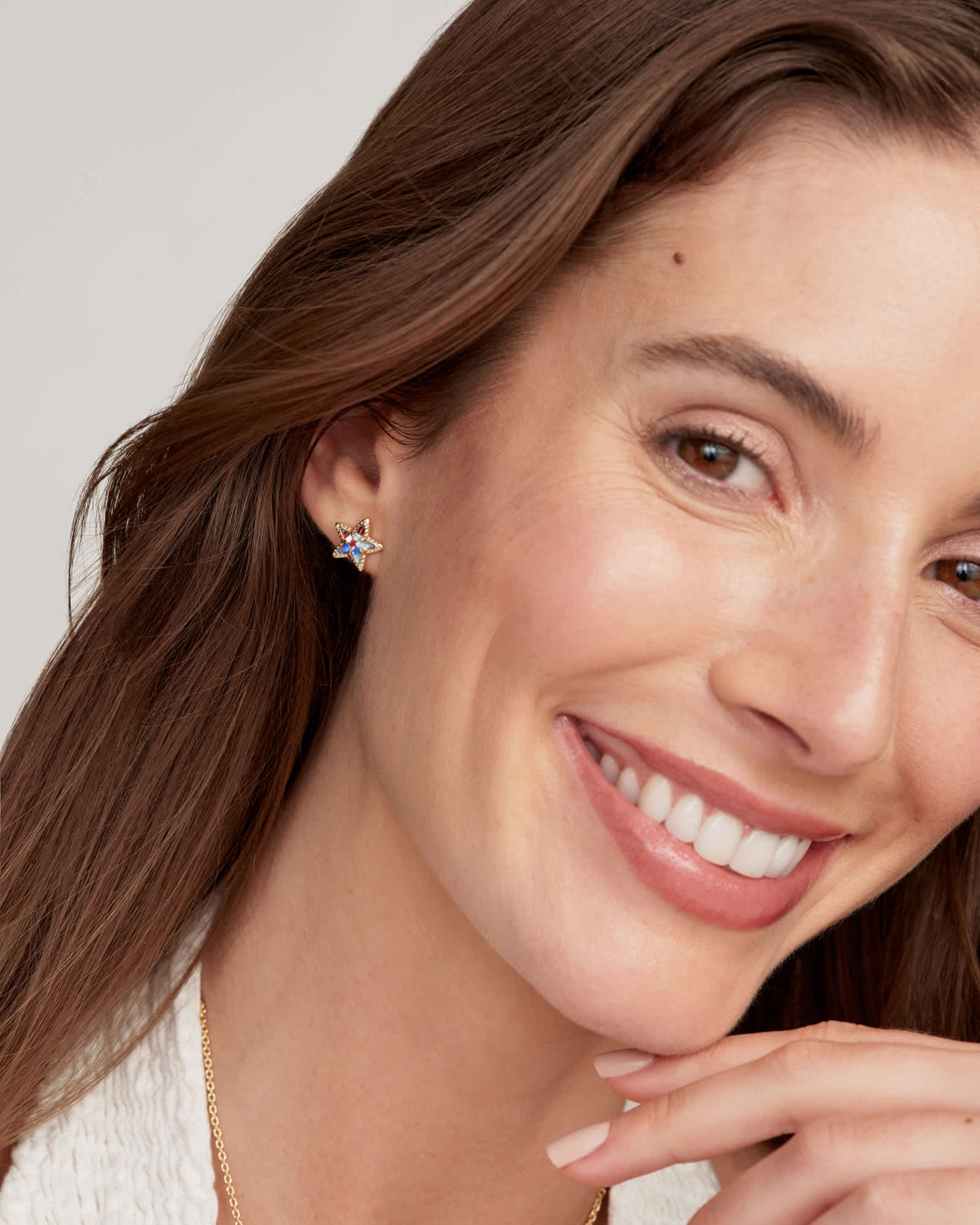 Gold Cassidy stud earrings featuring a star-spangled design with post closure.