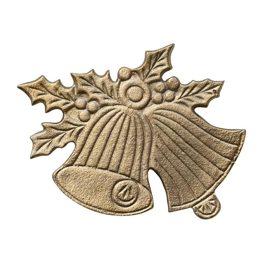 Cast aluminum trivet shaped like holly leaves and bells with a gold finish.
