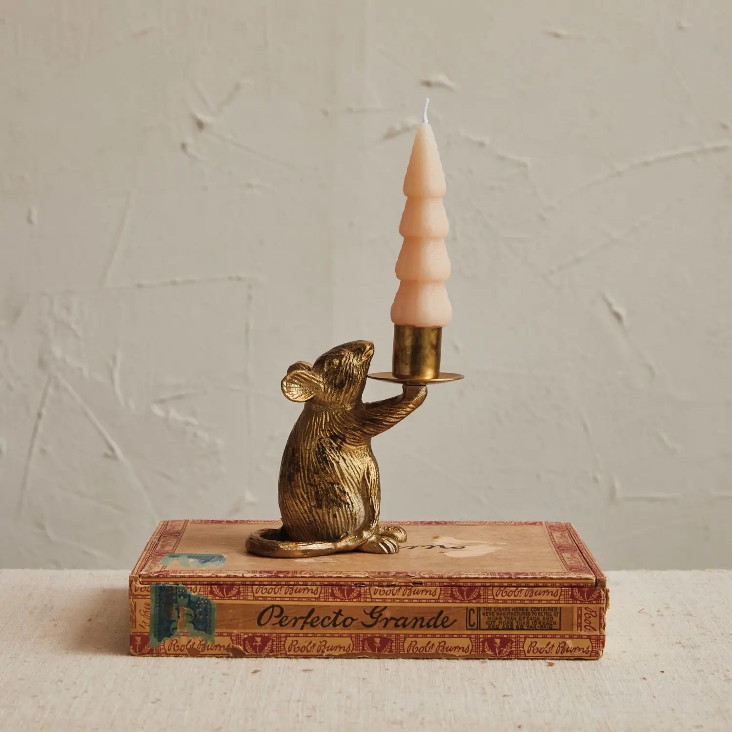 Cast aluminum mouse-shaped taper candleholder in antique gold finish