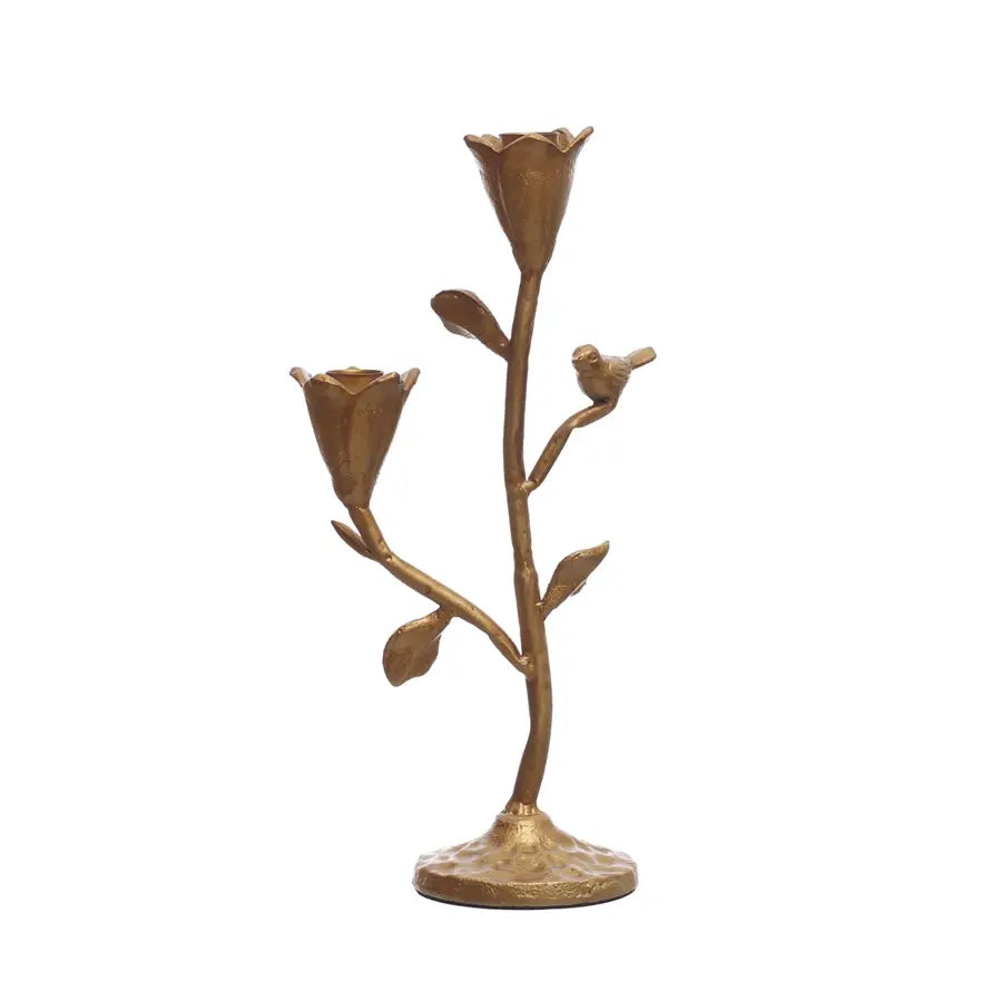 Gold cast iron candelabra featuring floral motifs and a bird silhouette.