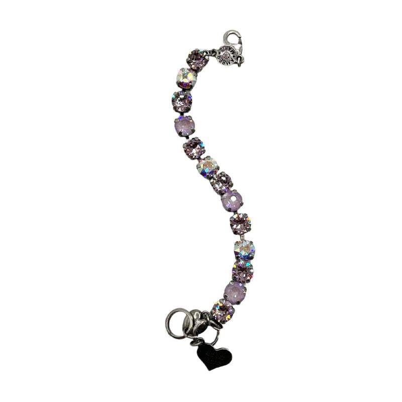 Classic Paris bracelet in lavender, lilac, white, and light green stones with an amber tag and Scotty dog heart charm.
