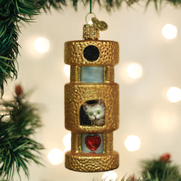 Cat Tower Ornament: a beige fabric cat tree with sisal scratching posts.