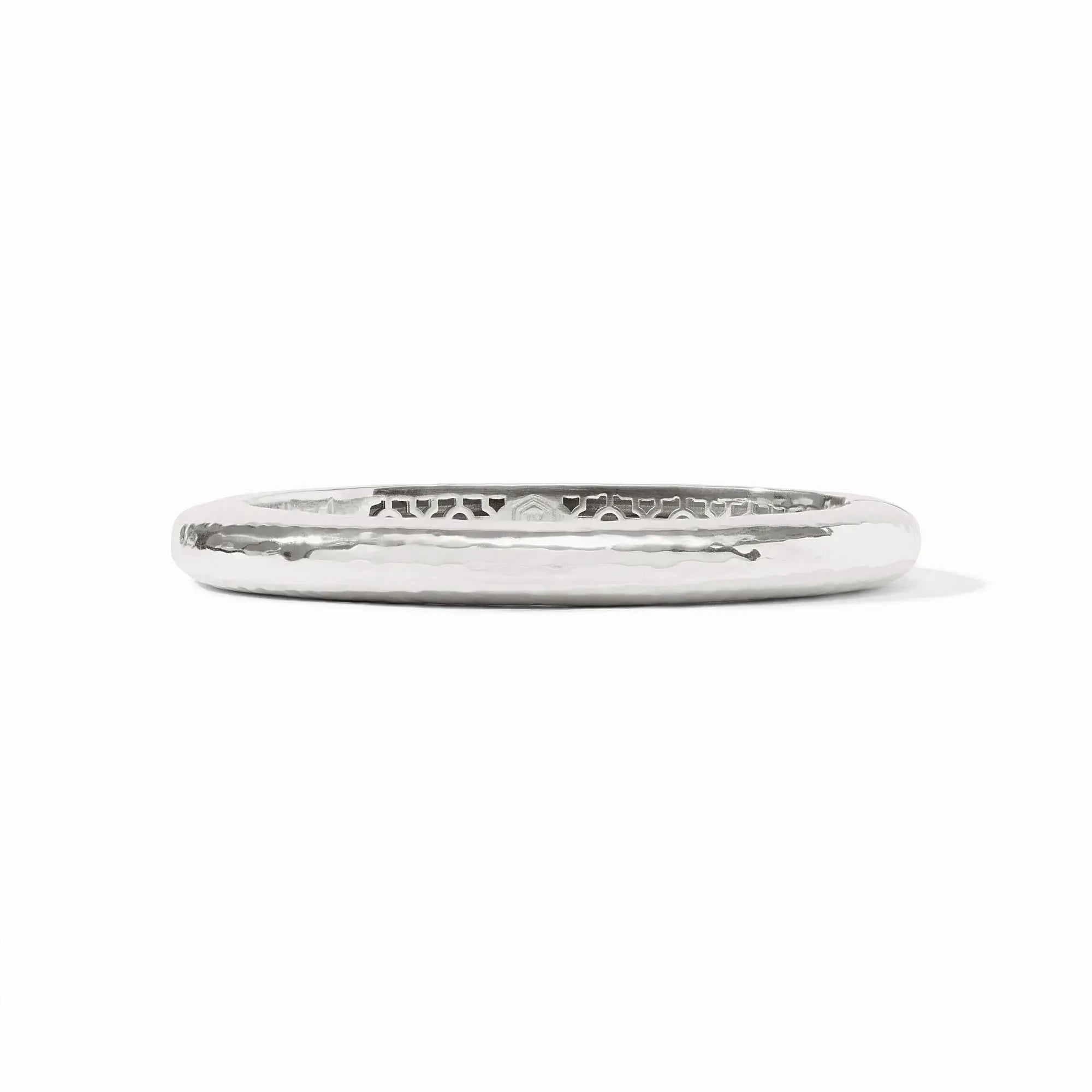 Silver oval hinge bangle with a lightly hammered texture.