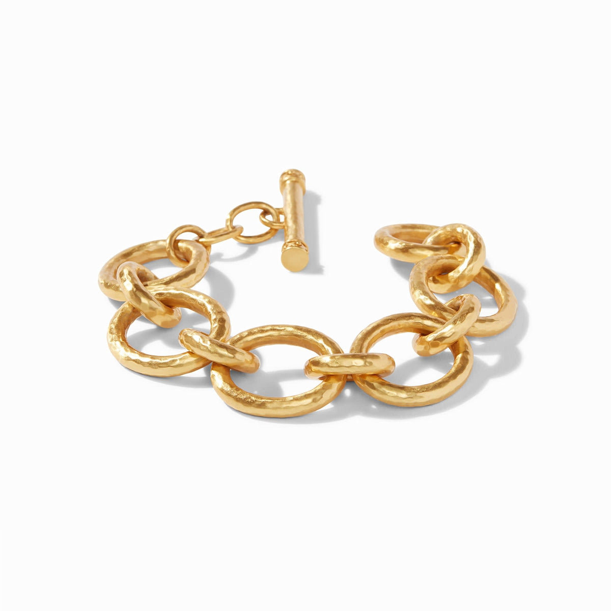 Catalina link bracelet in gold plate with hammered texture and pierced inner detail.