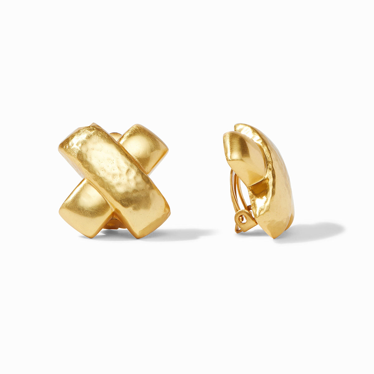 Gold-plated Catalina X clip with hammered finish overlapping smooth surface.