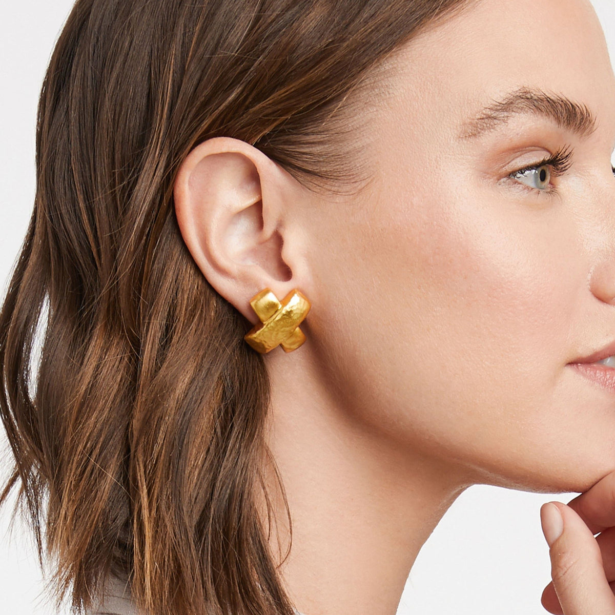 Catalina X earring in gold with a one-inch drop length.