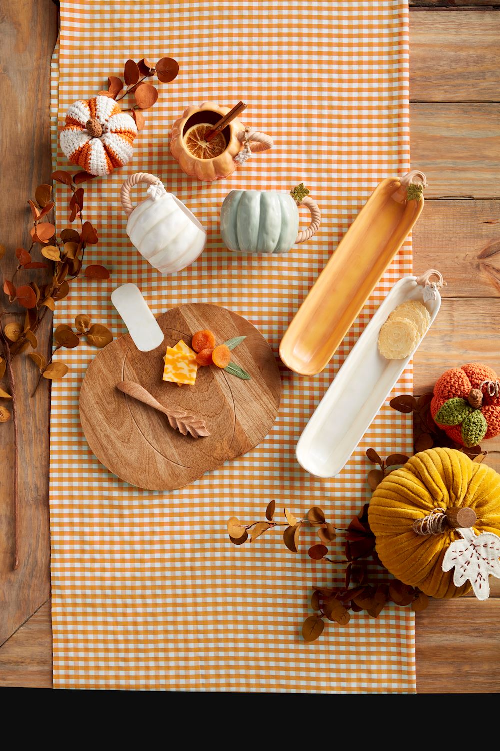 Set of pumpkin-shaped ceramic cracker dishes with a textured orange finish.