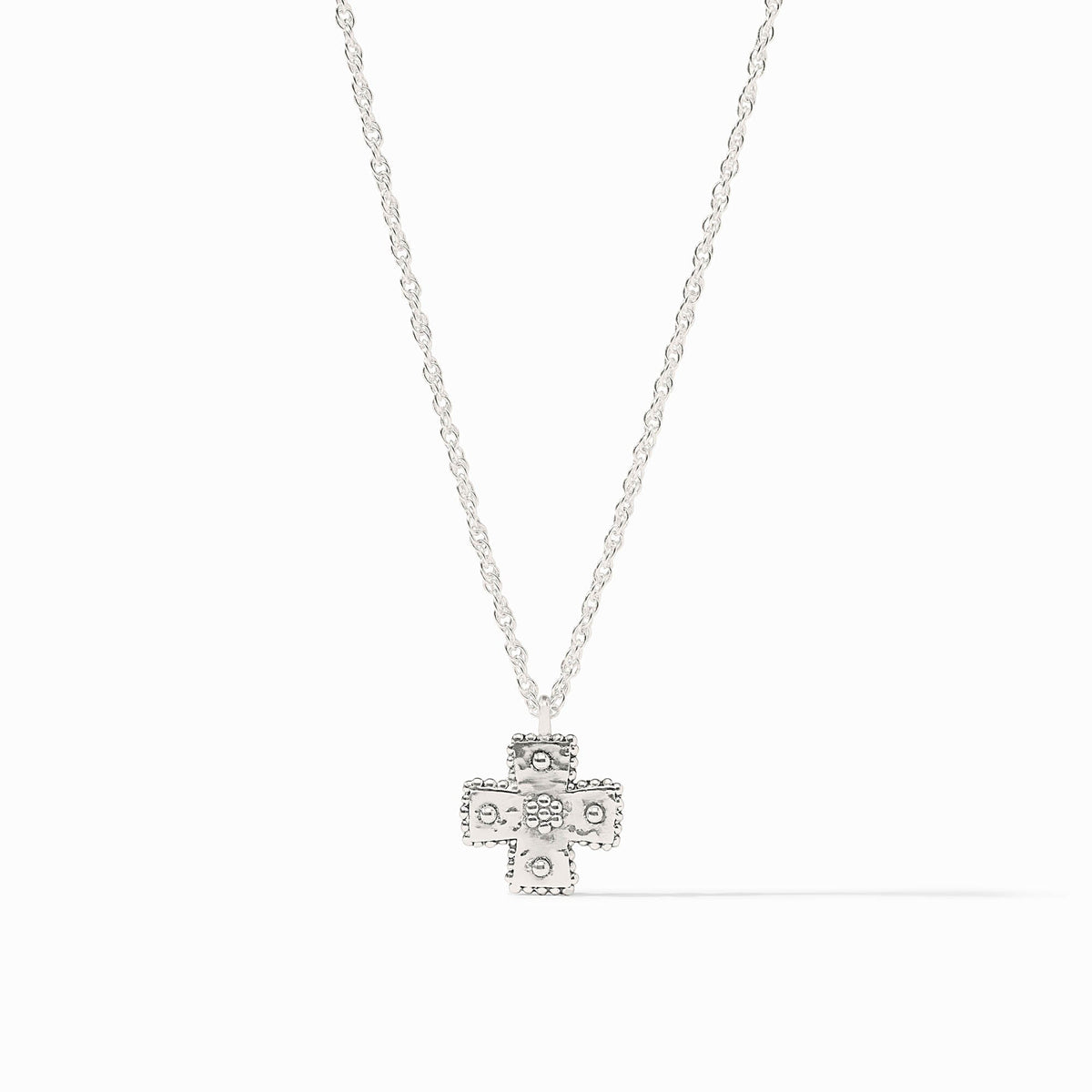 Canterbury Delicate Necklace in silver featuring a hand-hammered cross pendant on a fine chain.