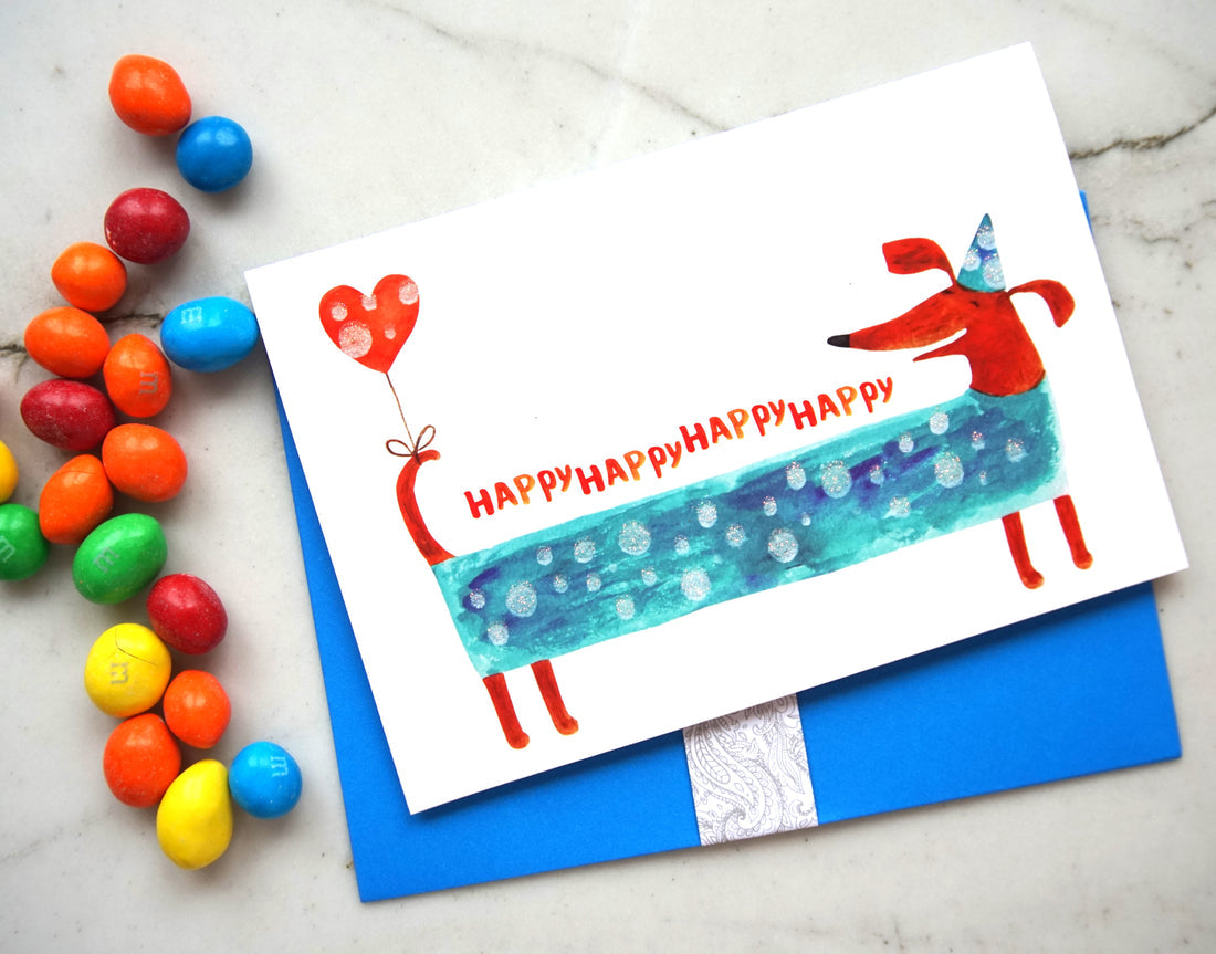 Glitter birthday card featuring a dachshund with text reading 'Happy Birthday to you!'