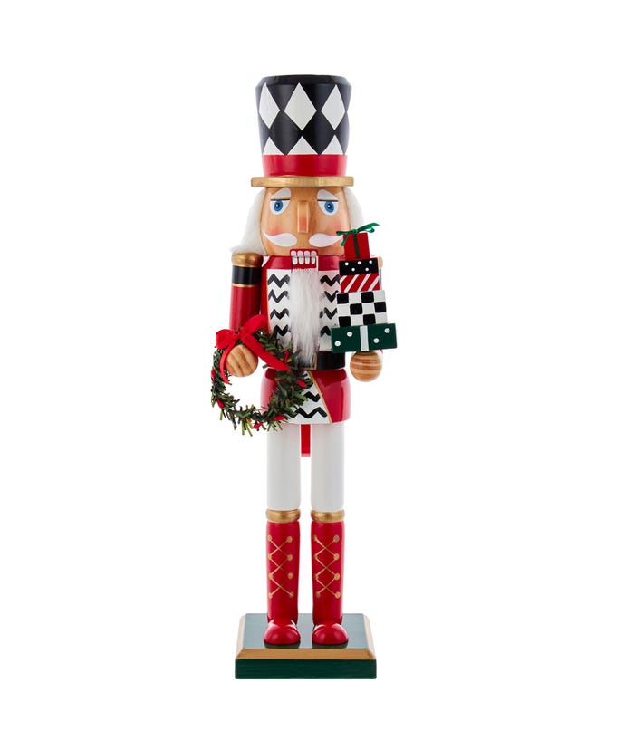 15-inch nutcracker in red, white, and black holding a wreath and a stack of gift boxes.