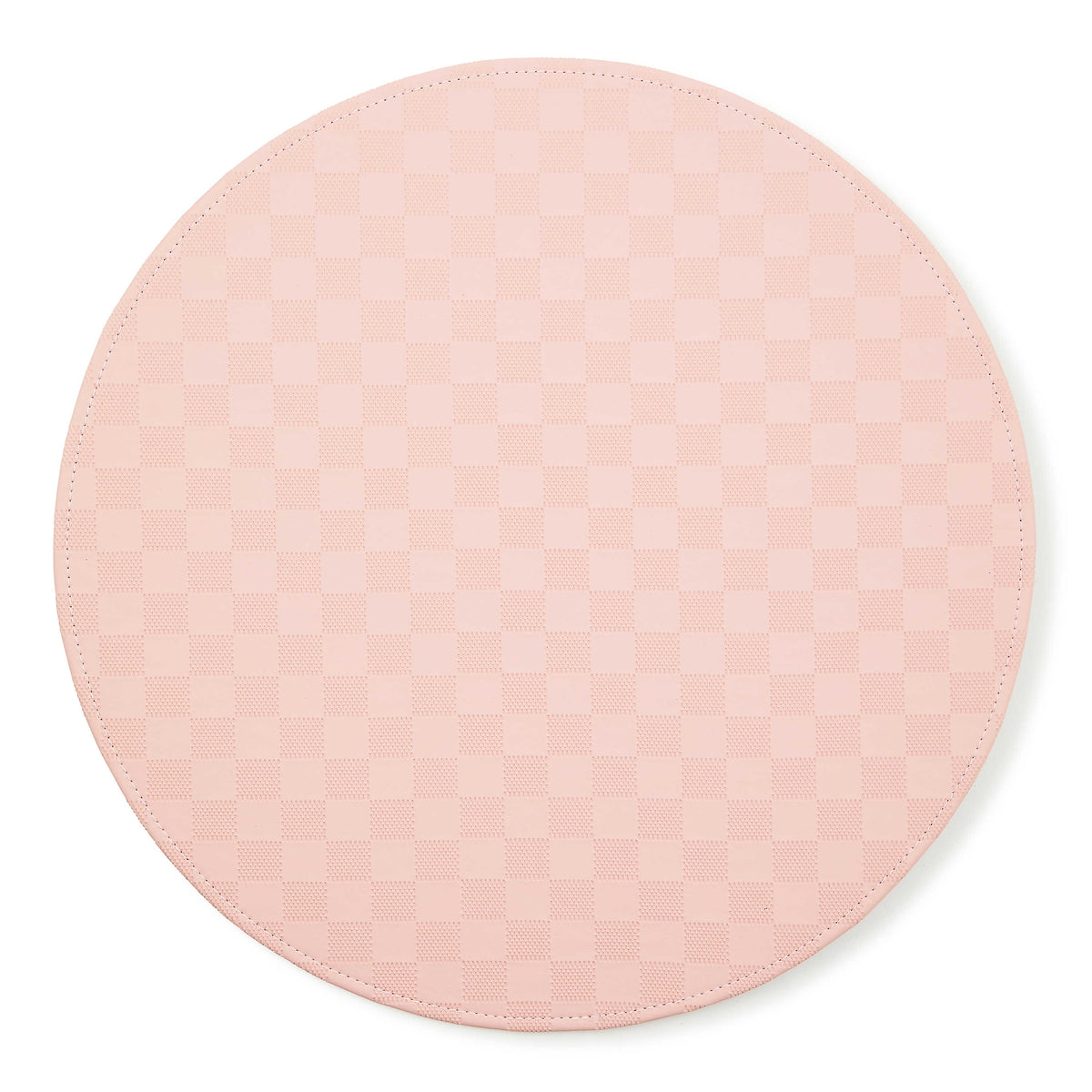 Round pink faux leather placemat with a subtle checkered pattern and stitched edge.
