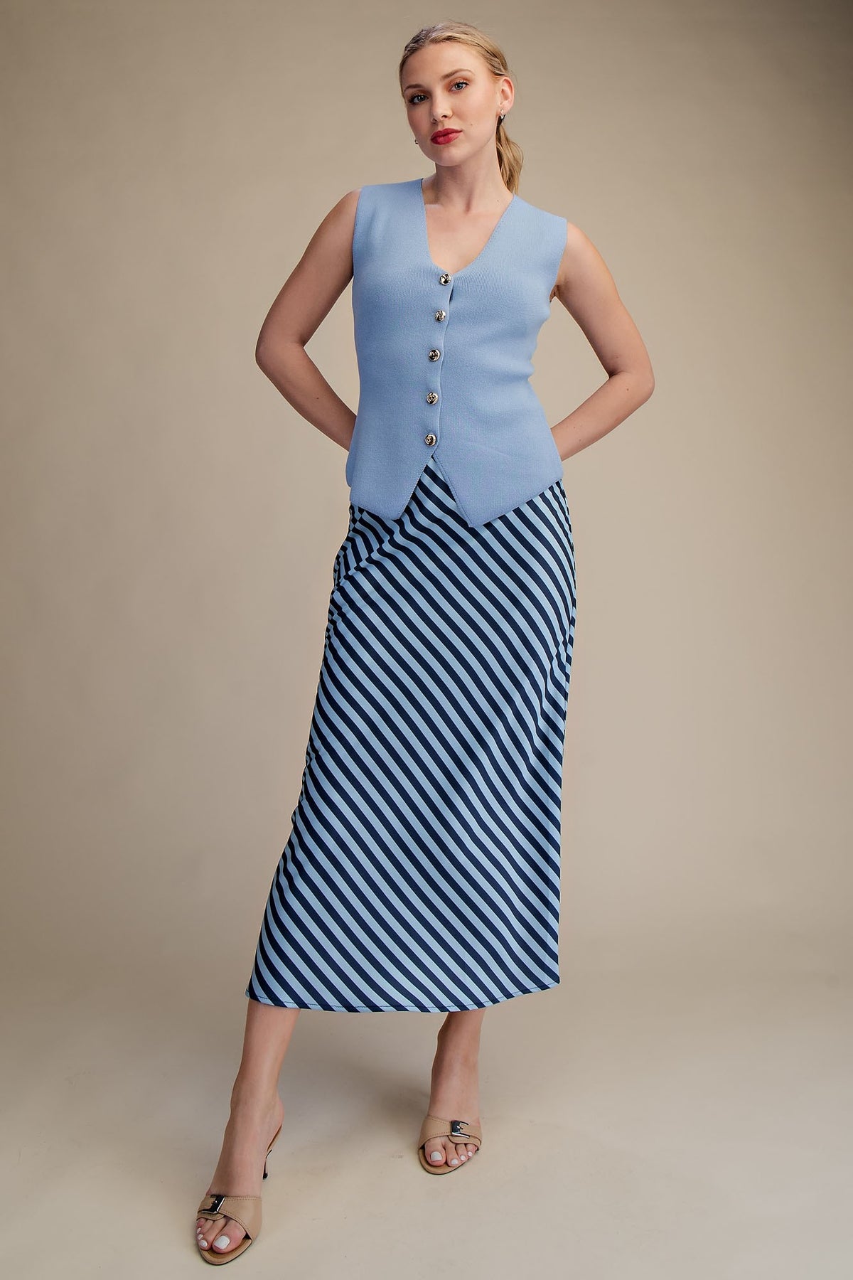 Ella waist elastic band midi skirt in solid black polyester with a flowing A-line silhouette.