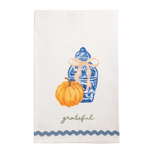 White cotton towel with a blue ginger jar, orange pumpkin, 'grateful' text, and blue ric-rac hem.