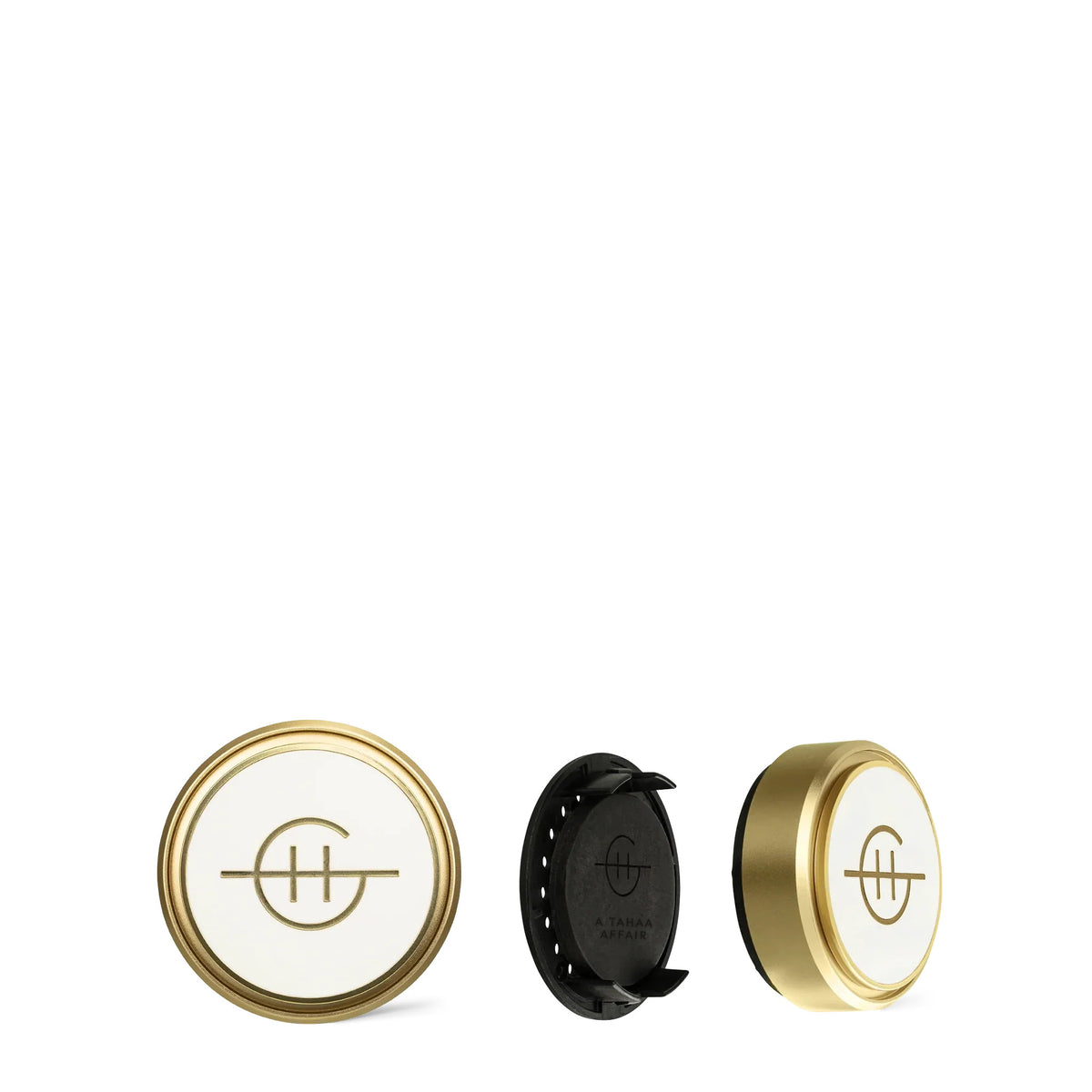 A Tahaa Affair Car Diffuser showing the gold and white faceplate, black back, and side view.