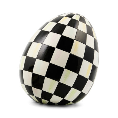 Small resin egg sculpture with a speckled natural finish.