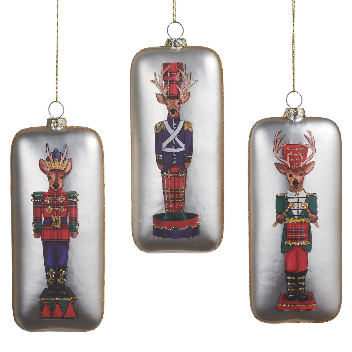 Three rectangular glass ornaments featuring deer nutcracker designs in traditional holiday attire.