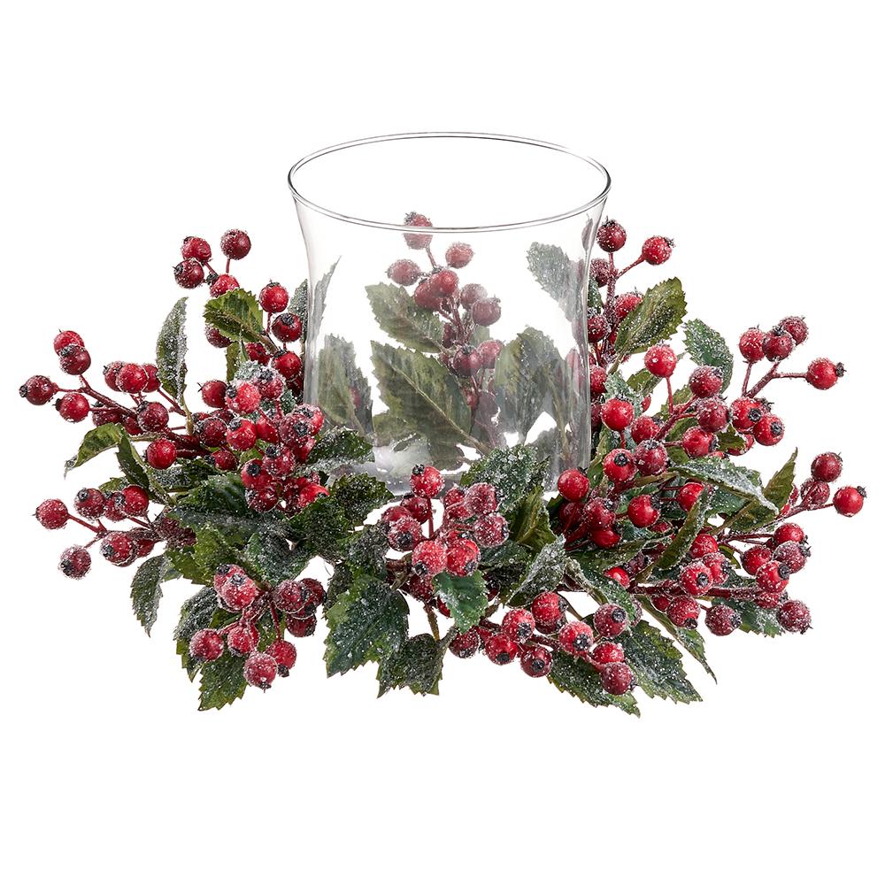 Iced red berry and green holly leaf centerpiece with a clear glass hurricane candleholder.