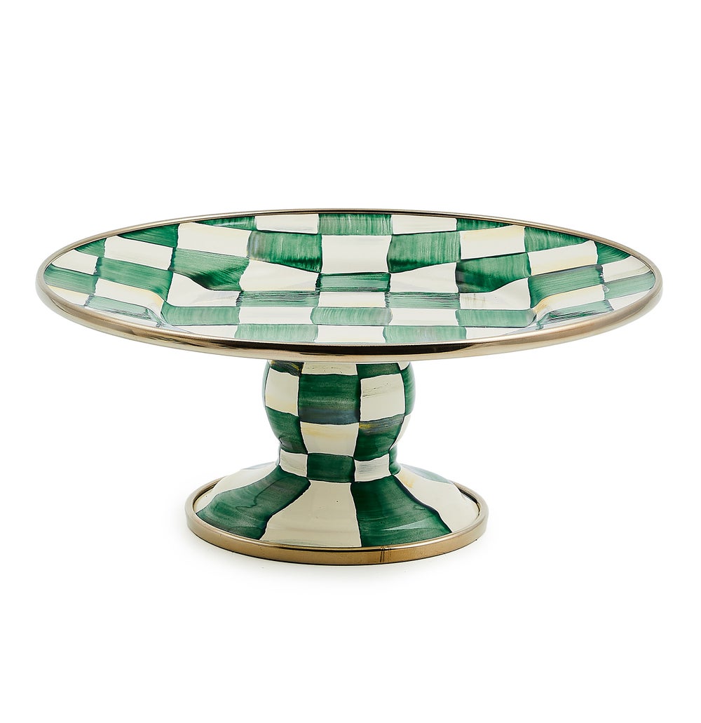 Hand-glazed steel pedestal platter with emerald checkered pattern and bronzed stainless rim.