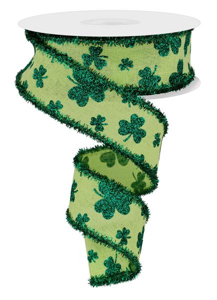 Green polyester glitter shamrock tinsel trim measuring one point five inches wide.