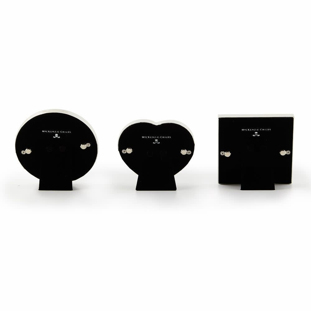 Set of three decorative frames: heart-shaped in silver with velvet backing, circular frame, and square frame.