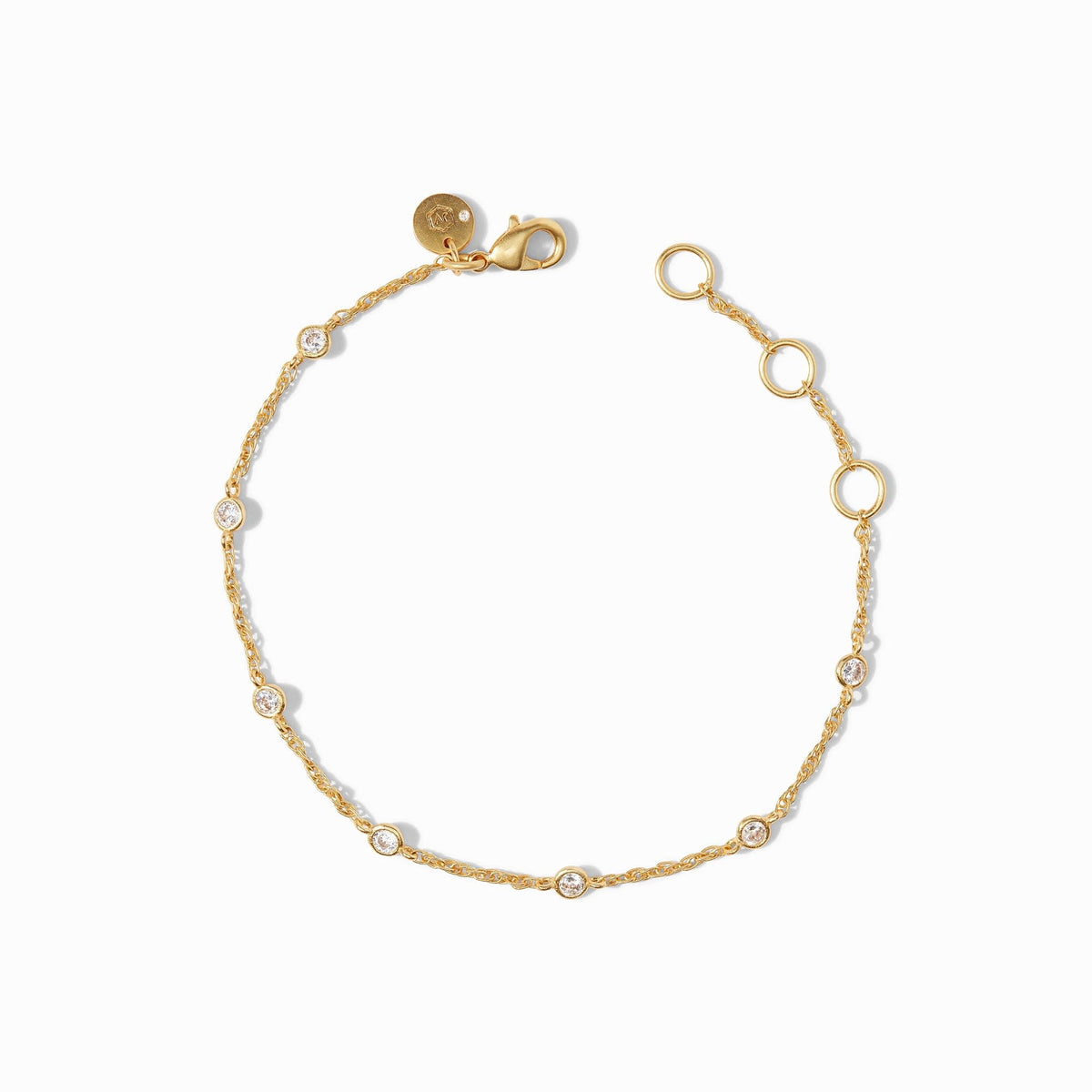 Overhead view of a Celeste Delicate Bracelet featuring seven small cubic zirconia stones on adjustable gold-plated chain.