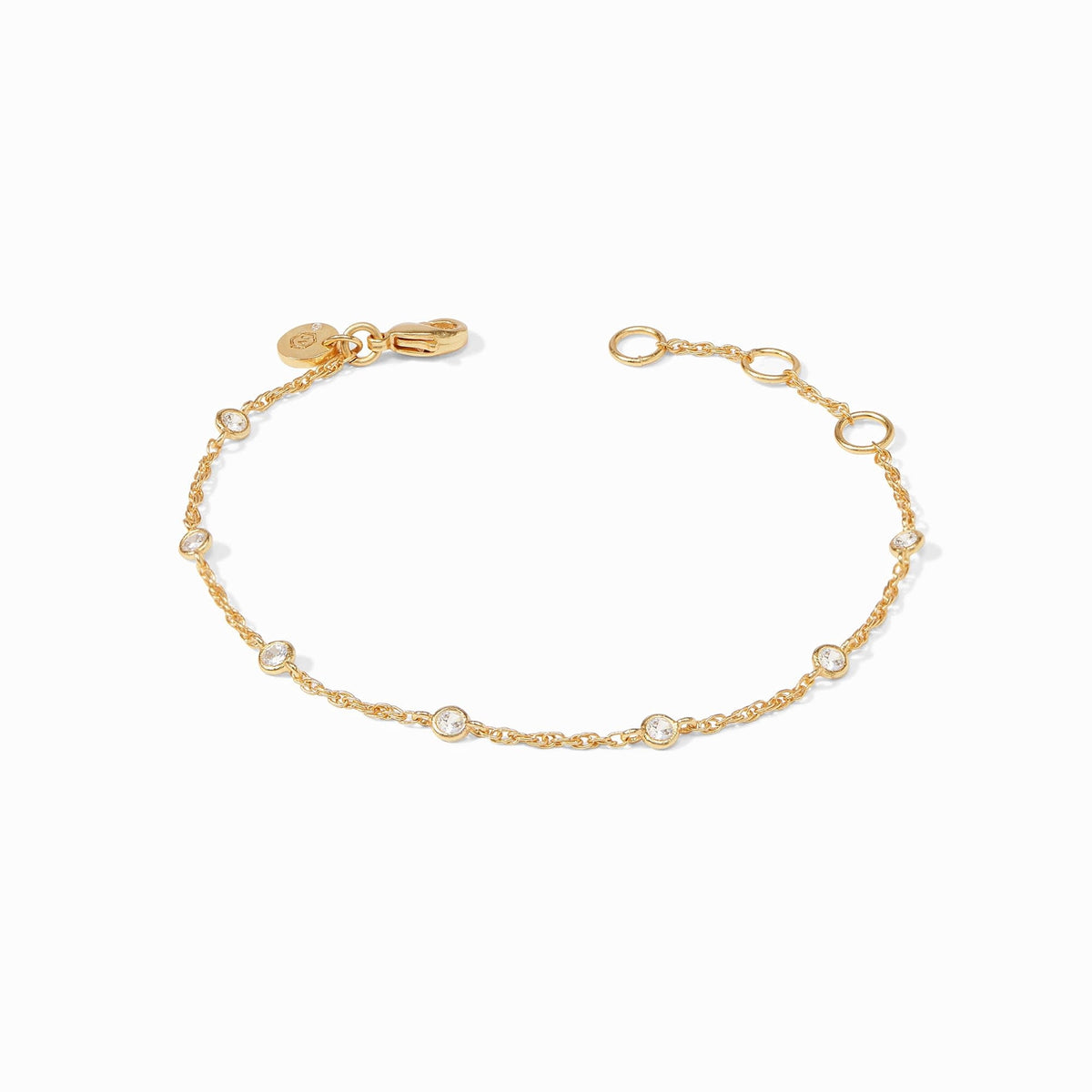 Delicate adjustable bracelet with seven small cubic zirconia stones on a dainty gold-plated chain.