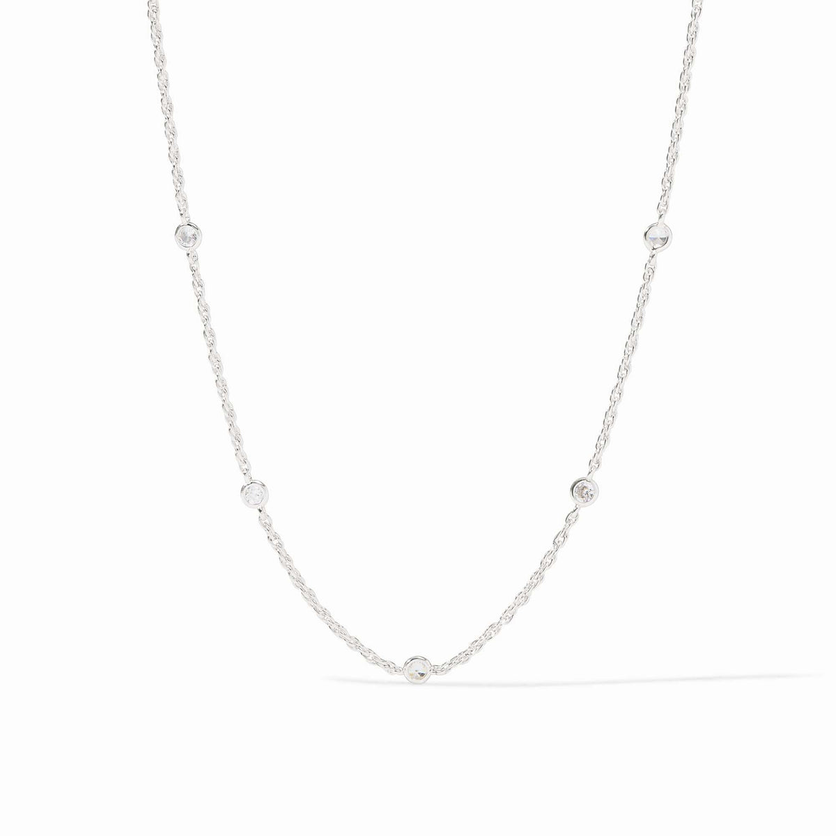 Silver station necklace with delicate cubic zirconia accents on a pure silver plate chain.