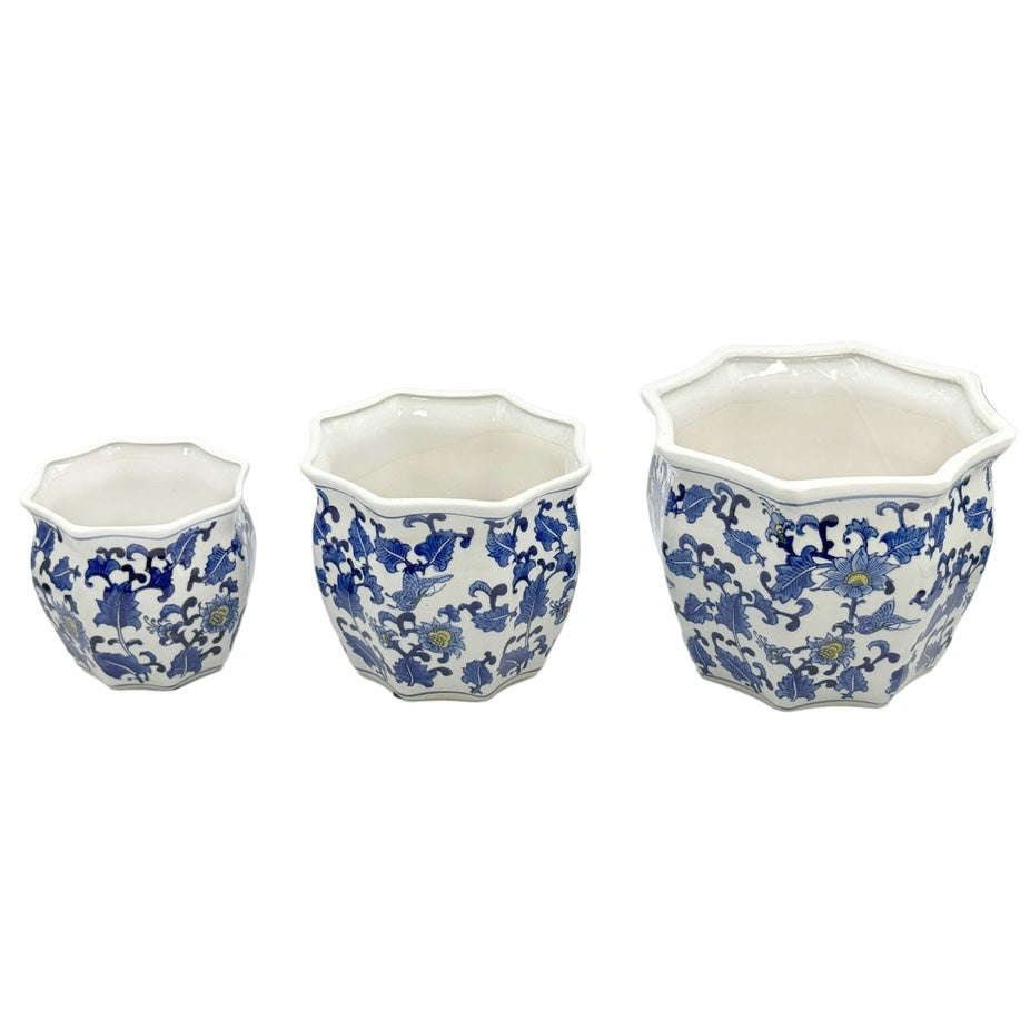 Blue and white ceramic planter pot with yellow accents featuring intricate fluting.