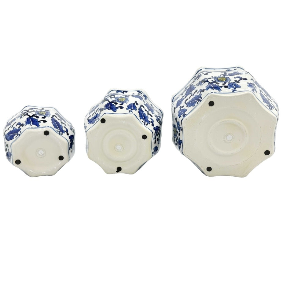 Ceramic Chinoiserie planter pot in blue and white with yellow accents featuring hand-painted fluting details.