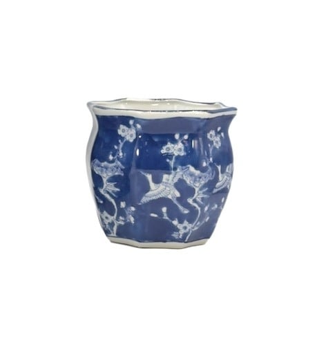 White ceramic planter pot with blue crane motif and fluted sides