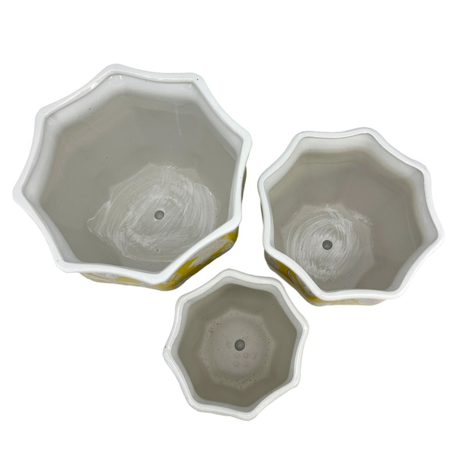 Yellow ceramic planter with white chinoiserie fluting and classic porcelain-style silhouette