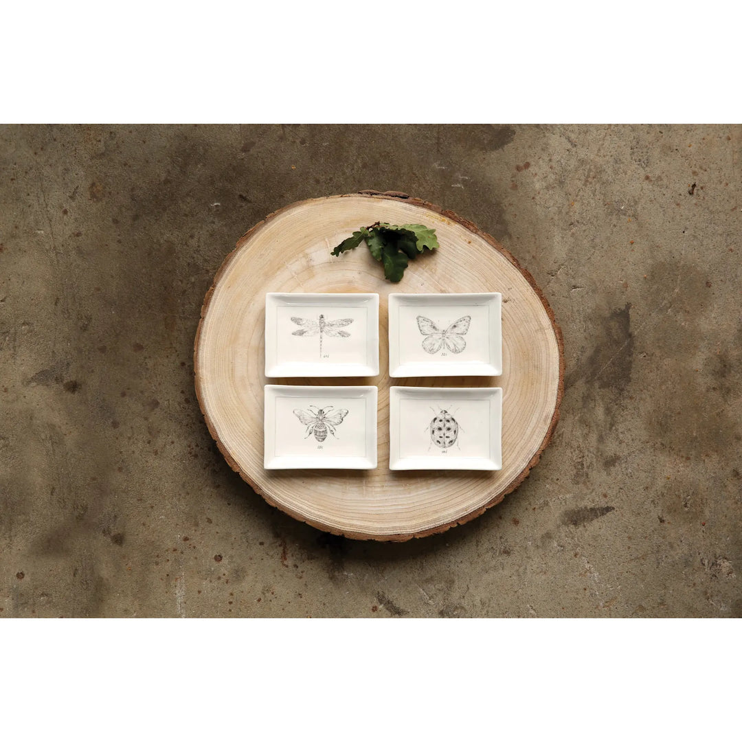 White ceramic dish with charcoal insect motif