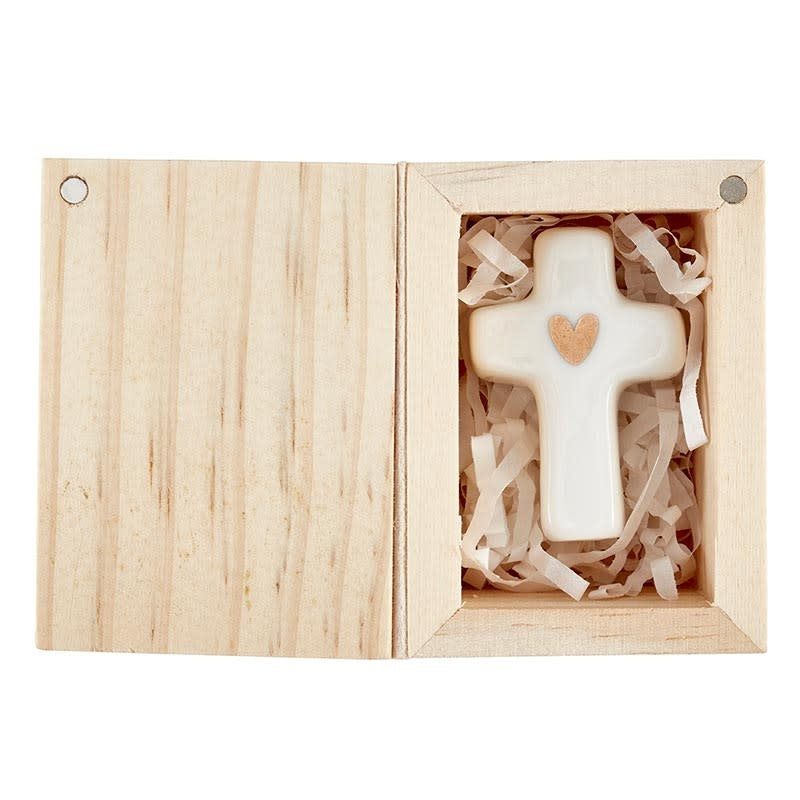 Ceramic figurine with gold embellishment inside a pine wood box.