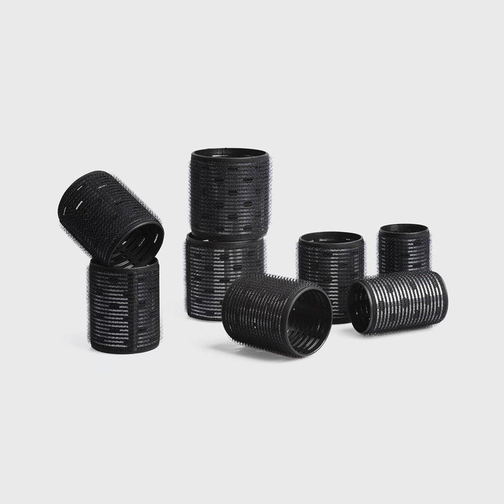 Eight-piece variety pack of black ceramic thermal hair rollers in assorted sizes.