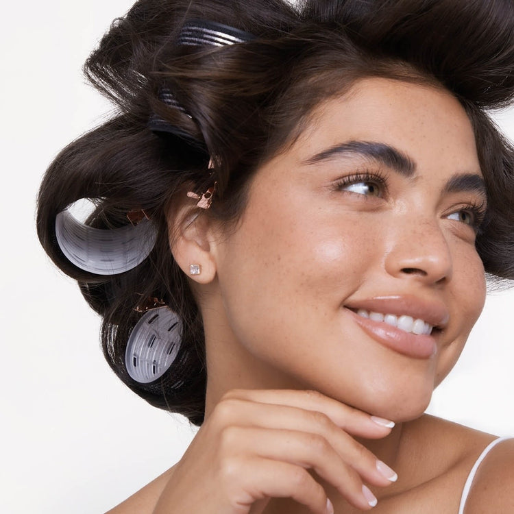 Eight-piece variety pack of white ceramic thermal hair rollers in assorted sizes.