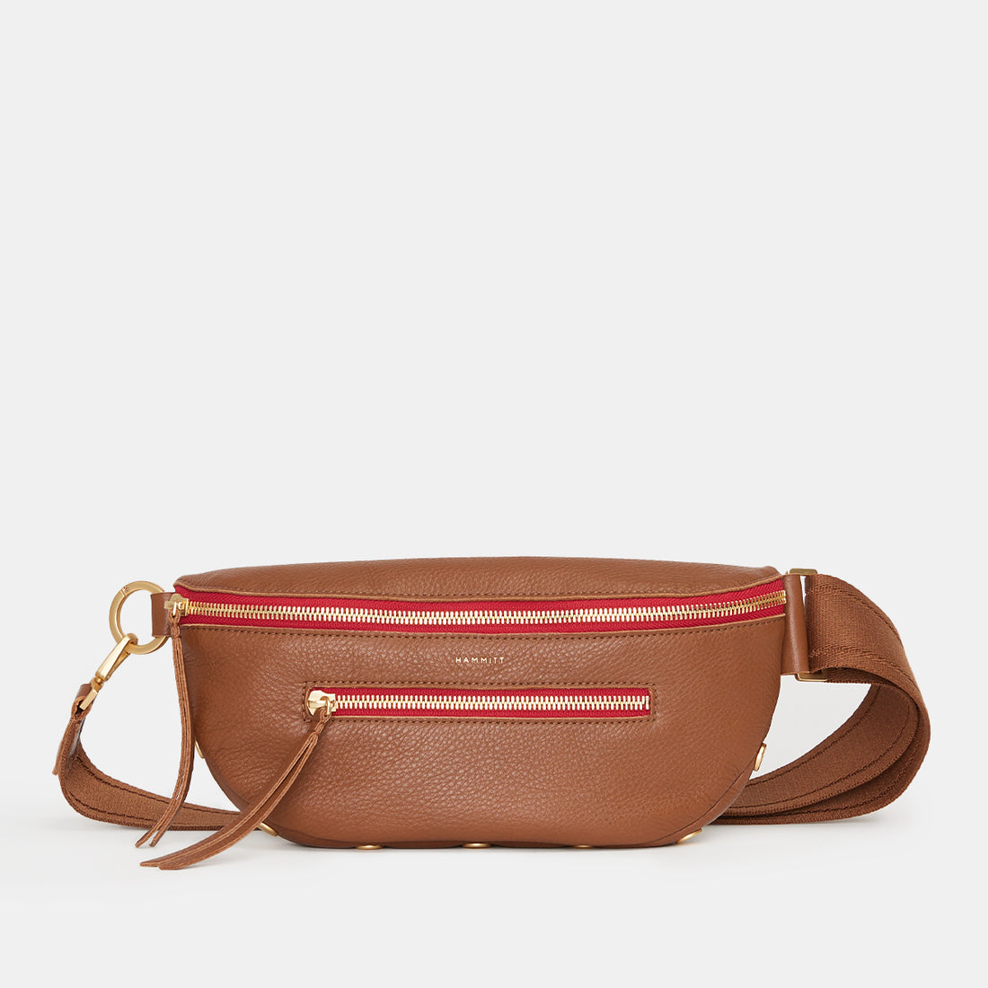 Oxblood red pebble leather crossbody bag with adjustable strap, gold hardware, and zippered pockets.