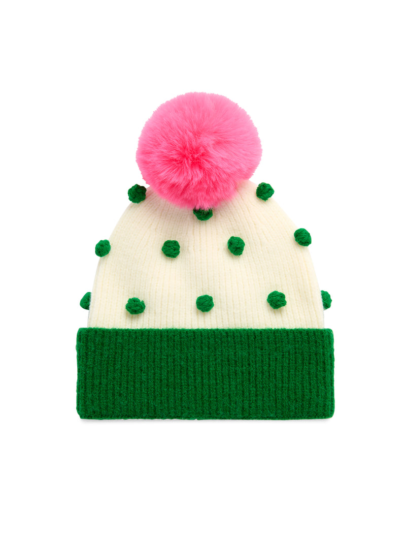 White ribbed knit beanie with green cuff, green pom pom accents, and a large pink faux fur pom pom.
