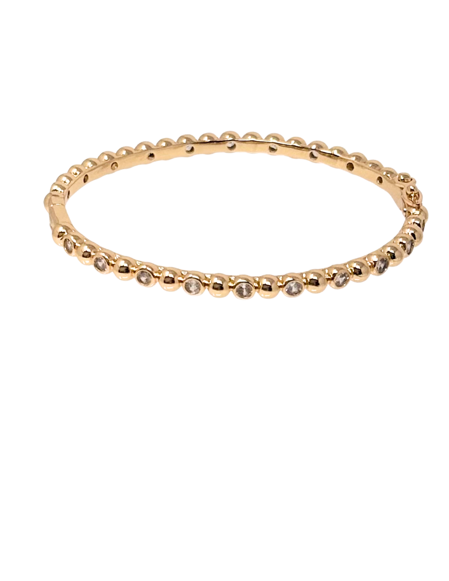 Gold dipped bracelet with a beaded texture and round cubic zirconia stones in bezel settings.