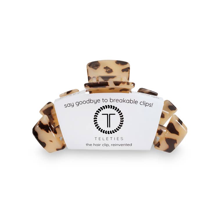 Medium hair clip with bendable teeth in a neutral tone designed for thick to medium-thickness hair.